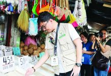 DA enforces rice price cap, probes market irregularities Regional Executive Director Dennis Arpia of the Department of Agriculture in Western Visayas checks rice stocks and prevailing market prices during an inspection at a public market in Iloilo City on June 1, 2026. The monitoring aims to ensure that retailers and traders comply with the P50-per-kilogam price cap on five-percent broken imported rice.