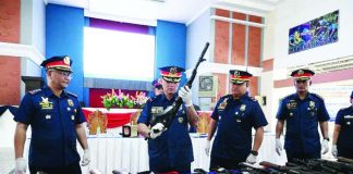Police Regional Office 6 director Brigadier General Randulf Tuaño presents some of the 3,683 voluntarily surrendered firearms collected across Western Visayas since 2019 during a display in Iloilo City on June 29. Police said the campaign aims to prevent crimes by taking loose, unregistered firearms out of circulation before they can be used in criminal activities. PRO-6