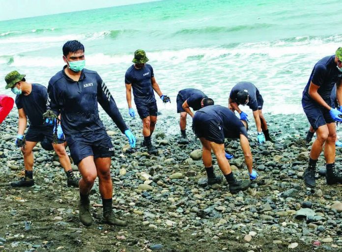 miagao algal bloom COASTAL CLEANUP. Soldiers, municipal responders, and volunteers remove algae deposits from the shoreline of Miag-ao, Iloilo as local authorities intensify cleanup efforts following an algal bloom incident that affected 86 residents in three coastal barangays. The town government has issued health advisories and urged the public to avoid exposure to affected waters pending further assessment. PHOTOS FROM MIAGAO INFOCEN
