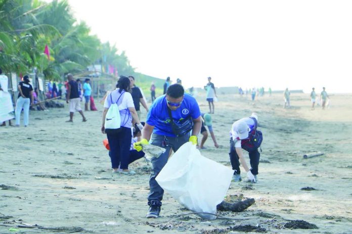 Volunteers from the Department of Environment and Natural Resources – Region 6, local government units, and community groups scour the shoreline of Oton, Iloilo during a coastal cleanup in celebration of World Oceans Day. They collected 72 sacks of garbage weighing 524.9 kilograms, highlighting the continuing fight against plastic pollution. DENR-6