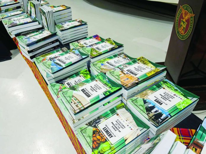 neljoy_cultural_mapping_copy_compressed_resized Copies of the newly launched cultural mapping inventories of Panay, Guimaras, and Negros Occidental are displayed during the unveiling ceremony at the University of the Philippines Visayas on June 19, 2026. NELJOY GALIGAO/PN