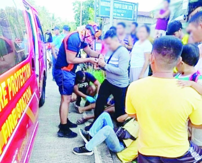 passi accident_compressed Personnel from the Passi City Fire Station administer first aid to the injured motorcycle drivers following a collision at an intersection in Barangay Aglalana, Passi City, on Tuesday morning, June 16, 2026. PASSI CITY FIRE STATION PHOTO
