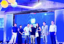Negros Power president and chief executive officer Roel Castro (center) accepts the plaque of recognition from Energy Regulatory Commission chairperson Atty. Francis Saturnino Juan (third from left) and Energy Secretary Sharon Garin (fourth from left) on June 26, 2026, for the utility's outstanding role in advancing the country's clean energy transition.