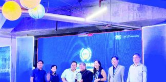 Negros Power president and chief executive officer Roel Castro (center) accepts the plaque of recognition from Energy Regulatory Commission chairperson Atty. Francis Saturnino Juan (third from left) and Energy Secretary Sharon Garin (fourth from left) on June 26, 2026, for the utility's outstanding role in advancing the country's clean energy transition.