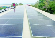 The Department of Industry says the proposed mandatory product certification of solar panel systems aims to prevent the Philippines from becoming a dumping ground for substandard solar products rejected by other countries.nPhoto shows the installation of solar panels at the new gym of the Toboso municipal government in Negros Occidental. RICHARD JAOJOCO/FACEBOOK PHOTO