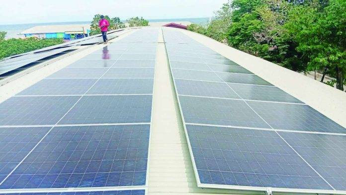 The Department of Industry says the proposed mandatory product certification of solar panel systems aims to prevent the Philippines from becoming a dumping ground for substandard solar products rejected by other countries.nPhoto shows the installation of solar panels at the new gym of the Toboso municipal government in Negros Occidental. RICHARD JAOJOCO/FACEBOOK PHOTO