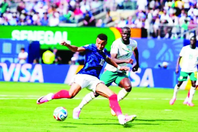sports_Fifa_compressed_resized Kylian Mbappe celebrates after scoring the opening goal for France during its 3-1 FIFA World Cup victory over Senegal at MetLife Stadium in East Rutherford, New Jersey. AP