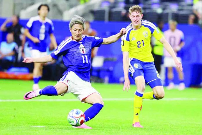 sports_Japan_copy_compressed_resized Daizen Maeda scores Japan’s opening goal during its 1-1 draw with Sweden that secured both teams a place in the 2026 FIFA World Cup Round of 32. AP