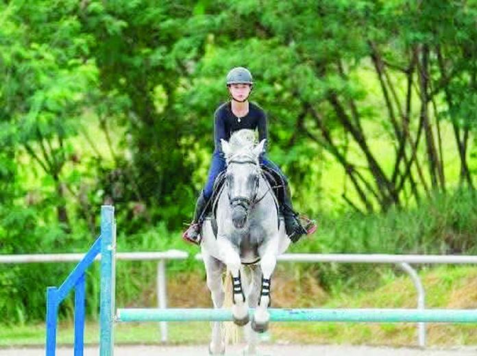 sports_Negros_compressed_resized Degrease rider Sophia Louie Begre-Lacson celebrates after winning the CSIY-B Two-Phase event in the second leg of the FEI Asia-Pacific Rising Star Academy in Pattaya, Thailand, where she represented the Philippines as its lone participant. CONTRIBUTED PHOTO