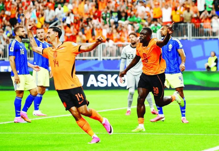 sports_Netherlands_compressed_resized Brian Brobbey celebrates with teammates after scoring one of his two goals as the Netherlands overwhelmed Sweden, 5-1, to take command of Group F in the 2026FIFA World Cup at NRG Stadium in Houston, Texas.