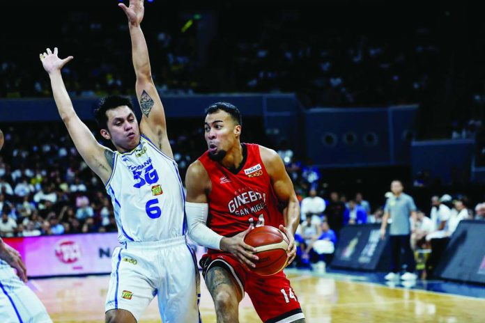 sports_PBA_compressed_resized Barangay Ginebra San Miguel Kings’ Stephen Holt attacks the defense of TNT Tropang 5G’s Rey Nambatac inside. PBA PHOTO
