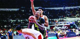 TNT Tropang 5G’s Chris McCullough tries to score against the defense of Barangay Ginebra San Miguel Kings’ Japeth Aguilar. PBA PHOTO