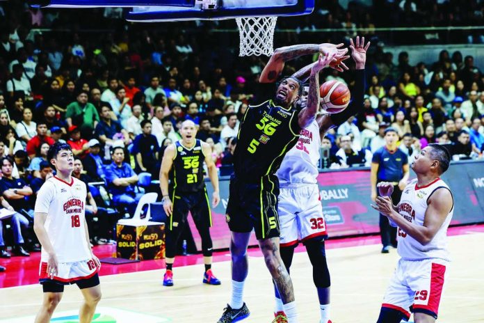 sports_PBA_compressed_resized TNT Tropang 5G’s Chris McCullough was clobbered by the defense of Barangay Ginebra San Miguel Kings' Justin Brownlee. PBA PHOTO