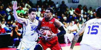 Barangay Ginebra San Miguel Kings' Justin Brownlee holds on to the ball after being defended by TNT Tropang 5G's Calvin Oftana. PBA PHOTO