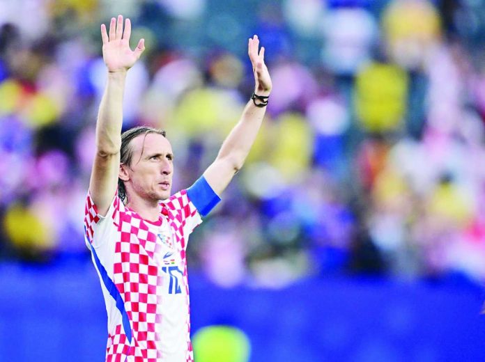 Croatia captain Luka Modric celebrates after becoming the oldest player to record an assist in FIFA World Cup history during his side's 2-1 victory over Ghana that sealed a place in the knockout stage. PHOTO COURTESY OF FABRIZIO ROMANO