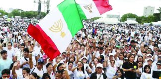 Members of Iglesia ni Cristo march along Roxas Boulevard to the Quirino Grandstand for the National Rally for Peace in this photo taken on January 2025. INQUIRER PHOTO: MARIANNE BERMUDEZ