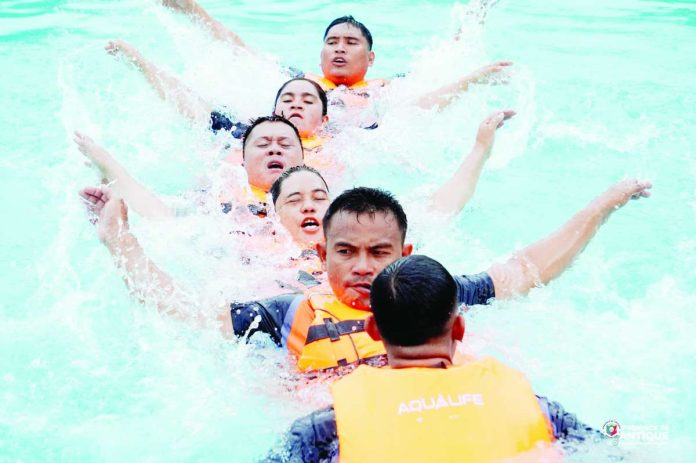 Participants performed the Centipede Formation Line drill at Stage 2 of the Paghangkat it Busalian (Obstacle Course Race) at the Binirayan Swimming Pool during the opening event of the 3rd Regional Rescuelympics 2026 in San Jose de Buenavista, Antique, on July 26. The challenge tested the teams' coordination, teamwork, and agility in simulated rescue operations. PROVINCE OF ANTIQUE PHOTO