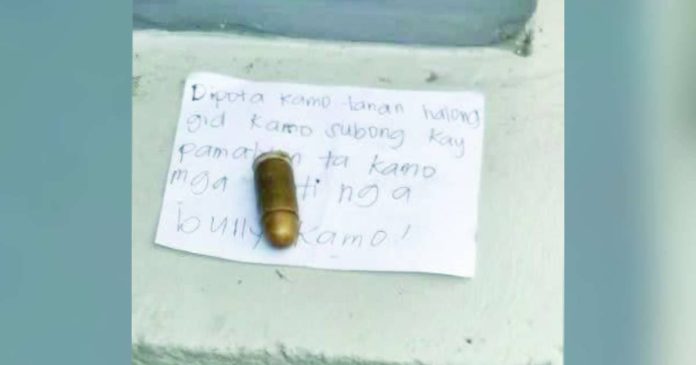 Bacolod ammunition copy_superimposed A live round of ammunition of still undetermined caliber and a handwritten note recovered inside the Senior High School building of the University of Negros Occidental–Recoletos in Bacolod City on July 16 are now in the custody of authorities. Police are investigating the origin and intent behind the recovered items and have clarified that there was no bomb threat or shooting incident at the university. PRO-NIR PHOTO