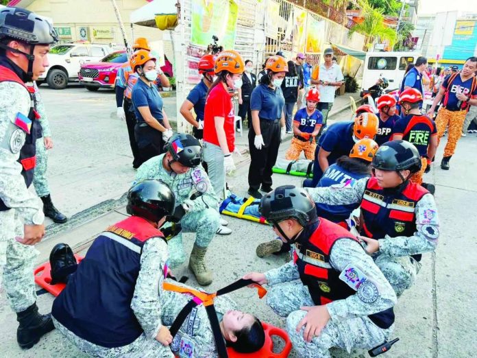 Bacolod_drills_copy_compressed_resized More than 100 emergency responders participated in the Rescue March in Bacolod City on July 18, demonstrating their capabilities in various emergency response operations, including firefighting, mass casualty response, vehicle extrication, collapsed structure rescue, and hazardous materials handling, as part of the city's observance of National Disaster Resilience Month. BCCO PHOTO