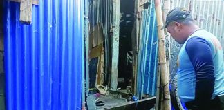 Police secured the area at Purok Tilapia, Barangay 3, Bacolod City, where a domestic altercation on July 12 claimed the lives of a soldier and his wife. Authorities have filed a homicide complaint against the soldier's 54-year-old father, who allegedly stabbed his daughter-in-law during the incident, while investigators later determined that the soldier died from an accidental firearm discharge and not by suicide. ONE WESTERN VISAYAS PHOTO