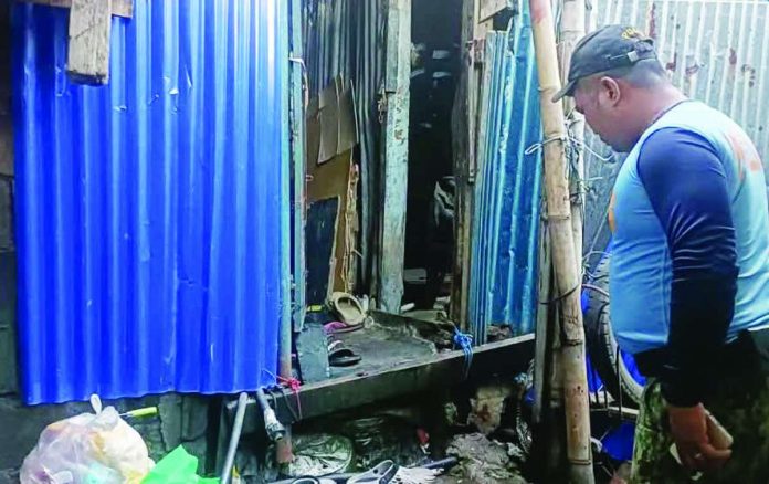 Bacolod_stabbing_copy_compressed_resized Police secured the area at Purok Tilapia, Barangay 3, Bacolod City, where a domestic altercation on July 12 claimed the lives of a soldier and his wife. Authorities have filed a homicide complaint against the soldier's 54-year-old father, who allegedly stabbed his daughter-in-law during the incident, while investigators later determined that the soldier died from an accidental firearm discharge and not by suicide. ONE WESTERN VISAYAS PHOTO