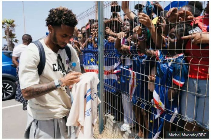 Cape_Verde_compressed_resized Cape Verde football team captain Ryan Mendes sign shirts for fans. BBC