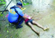 Personnel of the Cauayan Municipal Police Station examined the body of 29-year-old farmer Cyrus Tajedar after he was shot dead by five unidentified armed men outside his residence in Sitio Gut-ac, Barangay Abaca, Cauayan, Negros Occidental, on July 8. Police recovered seven spent 5.56-mm cartridge cases from the crime scene and are pursuing the unidentified suspects. CAUAYAN PNP PHOTO