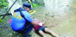 Personnel of the Cauayan Municipal Police Station examined the body of 29-year-old farmer Cyrus Tajedar after he was shot dead by five unidentified armed men outside his residence in Sitio Gut-ac, Barangay Abaca, Cauayan, Negros Occidental, on July 8. Police recovered seven spent 5.56-mm cartridge cases from the crime scene and are pursuing the unidentified suspects. CAUAYAN PNP PHOTO
