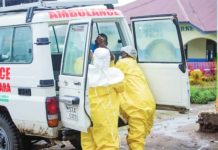 Congolese health workers receive a patient at the Rwampara General Hospital. The current outbreak of Ebola in the Democratic Republic of Congo began in May. REUTERS