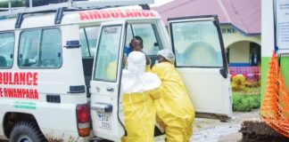 Congolese health workers receive a patient at the Rwampara General Hospital. The current outbreak of Ebola in the Democratic Republic of Congo began in May. REUTERS