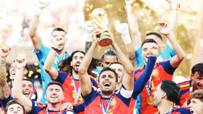 FIFA Rodri, captain of Spainm lifts the FIFA World Cup Winner’s Trophy after the team’s victory following the final match against Argentina at New York New Jersey Stadium. GETTY IMAGES
