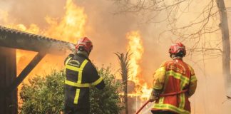 Firefighters battle flames in Lège-Cap-Ferret, south-western France. EPA