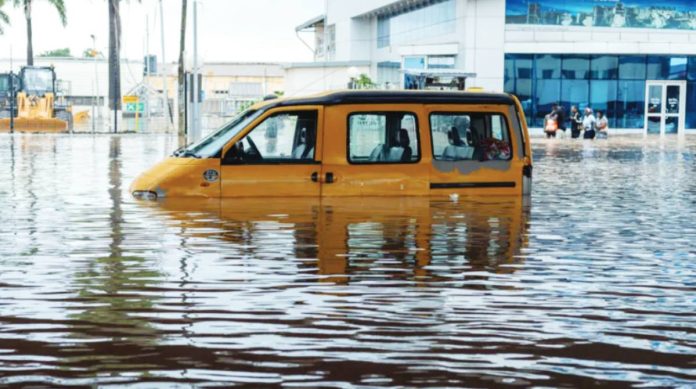 Ghana A yellow van is half-submerged in floodwater in the Ghanaian capital of Accra. EPA