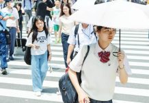 Japan temperatures soar over 40C as extreme weather events get more intense worldwide Japanese people walk over a crossroad on a hot summer day. GETTY IMAGES