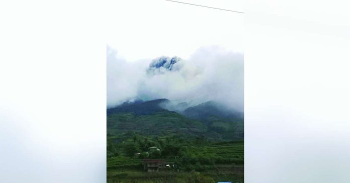 Kanlaon eruption_compressed_superimposed Kanlaon Volcano spewed a dark gray ash plume during a moderately explosive eruption at 7:33 a.m. on July 9, sending volcanic ash as high as three kilometers above the summit and causing ashfall in parts of Negros and Cebu. Despite the eruption, PHIVOLCS maintained Alert Level 2 and reminded the public to stay out of the four-kilometer Permanent Danger Zone and remain alert for possible volcanic hazards. KUYA RANDY FB PHOTO