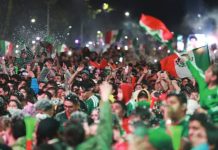 A huge crowd of fans wearing Mexico’s green football kit and waving the country’s flag celebrate the team’s 2-0 World Cup win against Ecuador in Mexico City. More than one million people took to the streets of Mexico City following Mexico’s win in the knockout stages. GETTY IMAGES
