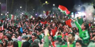 A huge crowd of fans wearing Mexico’s green football kit and waving the country’s flag celebrate the team’s 2-0 World Cup win against Ecuador in Mexico City. More than one million people took to the streets of Mexico City following Mexico’s win in the knockout stages. GETTY IMAGES