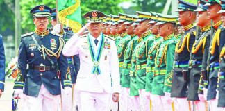 TOP DEFENDER. New Armed Forces of the Philippines Chief of Staff General Antonio Nafarrete (right) troops the line at Camp Aguinaldo in Quezon City July 21, 2026 after he took over the post, replacing retired General Romeo Brawner Jr. In his speech, Nafarrete said his priority is to strengthen territorial defense capabilities and accelerate the ongoing military modernization. PNA