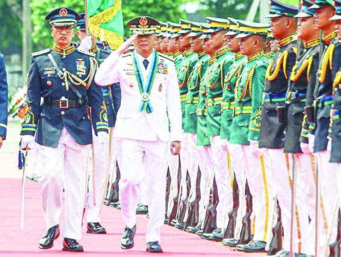 Nafarrete WPS copy_compressed TOP DEFENDER. New Armed Forces of the Philippines Chief of Staff General Antonio Nafarrete (right) troops the line at Camp Aguinaldo in Quezon City July 21, 2026 after he took over the post, replacing retired General Romeo Brawner Jr. In his speech, Nafarrete said his priority is to strengthen territorial defense capabilities and accelerate the ongoing military modernization. PNA