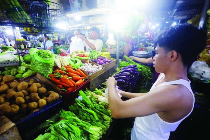 MARKET ABUNDANCE. Fresh vegetables are displayed at a stall inside Paco Public Market in Manila. Department of Agriculture Secretary Francisco Tiu Laurel Jr. said the country’'s vegetable supply remains stable, despite oversupply and plunging farmgate prices that affected highland produce.