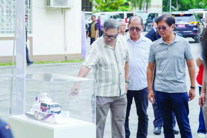 PCSO1_copy_compressed_resized Philippine Charity Sweepstakes Office’s General Manager Melquiades A. Robles (left) says the completion of the nationwide provincial rollout of patient transport vehicles fulfills President Ferdinand R. Marcos Jr.'s (right) directive to make emergency medical assistance more accessible to every Filipino.