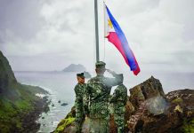 Filipino soldiers take part in a flag raising ceremony in Mavulis Island, Batanes, in this photo take on June 29, 2023. Chinese academics claim Batanes belongs to China through Taiwan. FILE PHOTO/AGENCE FRANCE-PRESSE