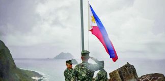 Filipino soldiers take part in a flag raising ceremony in Mavulis Island, Batanes, in this photo take on June 29, 2023. Chinese academics claim Batanes belongs to China through Taiwan. FILE PHOTO/AGENCE FRANCE-PRESSE