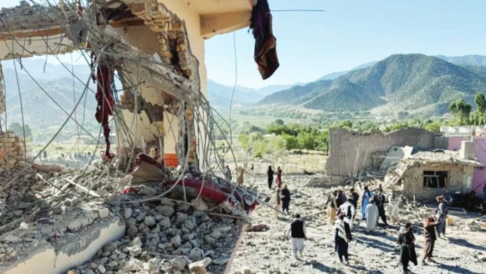 Pakistan People inspect a damaged house at the site of Pakistani airstrikes in Mandokhail village in Paktia province, Afghanistan. REUTERS