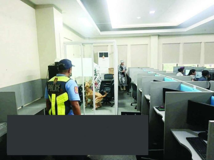 San_Carlos_bomb_threat_compressed_resized Personnel of the San Carlos City Police Station, together with the Philippine Coast Guard - San Carlos K9 Unit and the City Disaster Risk Reduction and Management Office, cleared the Empire One BPO in Barangay 2, San Carlos City, Negros Occidental after a bomb detection operation yielded negative result. PRO-NIR PHOTO