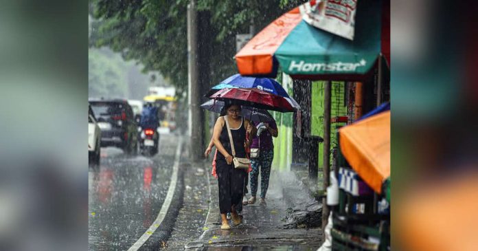 Typhoon Inday_compressed_superimposed Pedestrians are caught in a downpour in Quezon City. Super Typhoon Inday entered the Philippine Area of Responsibility at 3 a.m. on Wednesday. Metro Manila is expected to bear the brunt of its impact. PNA