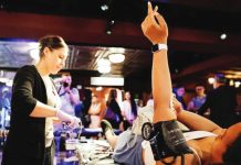 A woman raises her arm following a blood donation in the United States. A blood supply shortage in the US has reached a “crisis” level, according to the American Red Cross. GETTY IMAGES