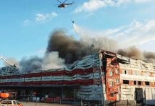 Russia launches major ballistic missile attack on Ukrainian cities; 8 killed, dozens injured A firefighting helicopter drops water over the site of a Russian missile strike, amid Russia's attack on Ukraine, in Kyiv region. The latest Russian strikes hit both residential and non-residential buildings. REUTERS