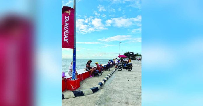 Visitors chilling at the Valladolid Sunset Boulevard in Barangay Palaka before the municipal government ordered the temporary suspension of all tourism and economic activities following a fatal road accident that claimed two lives and left another person seriously injured on July 5. Authorities are conducting a comprehensive safety assessment and implementing enhanced traffic management measures before the boulevard reopens to the public. SOXIALLY FB PHOTO
