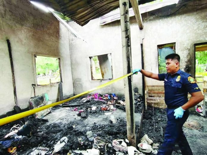 anilao_fire_compressed_resized A fire officer from the Bureau of Fire Protection-Anilao inspects the gutted house in Barangay Dangulaan, Anilao, Iloilo. The blaze claimed the life of an 84-year-old woman on Wednesday night, July 22, 2026. PHOTO COURTESY OF BFP-ANILAO